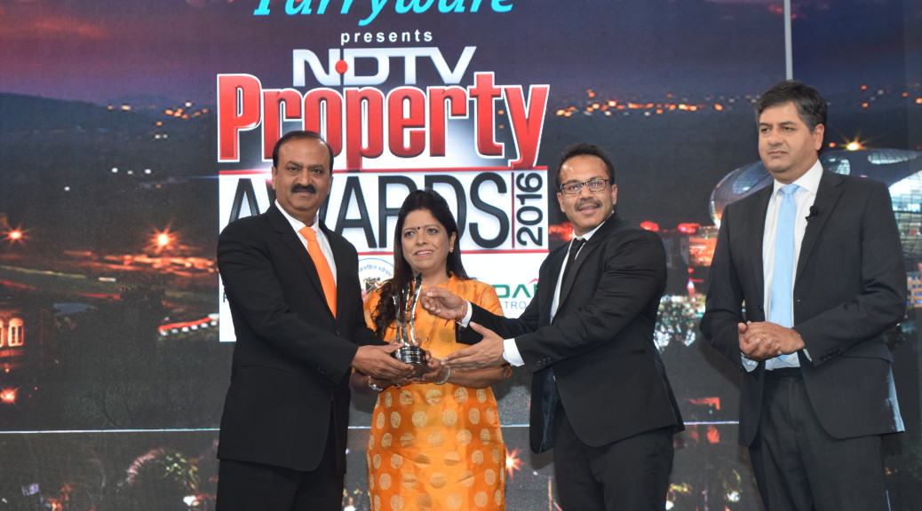 mr and Mrs Gaur receiving awards